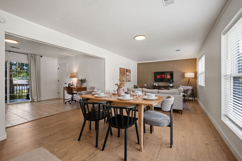 Gorge Getaway open-plan living and dining room with sliding door to private deck